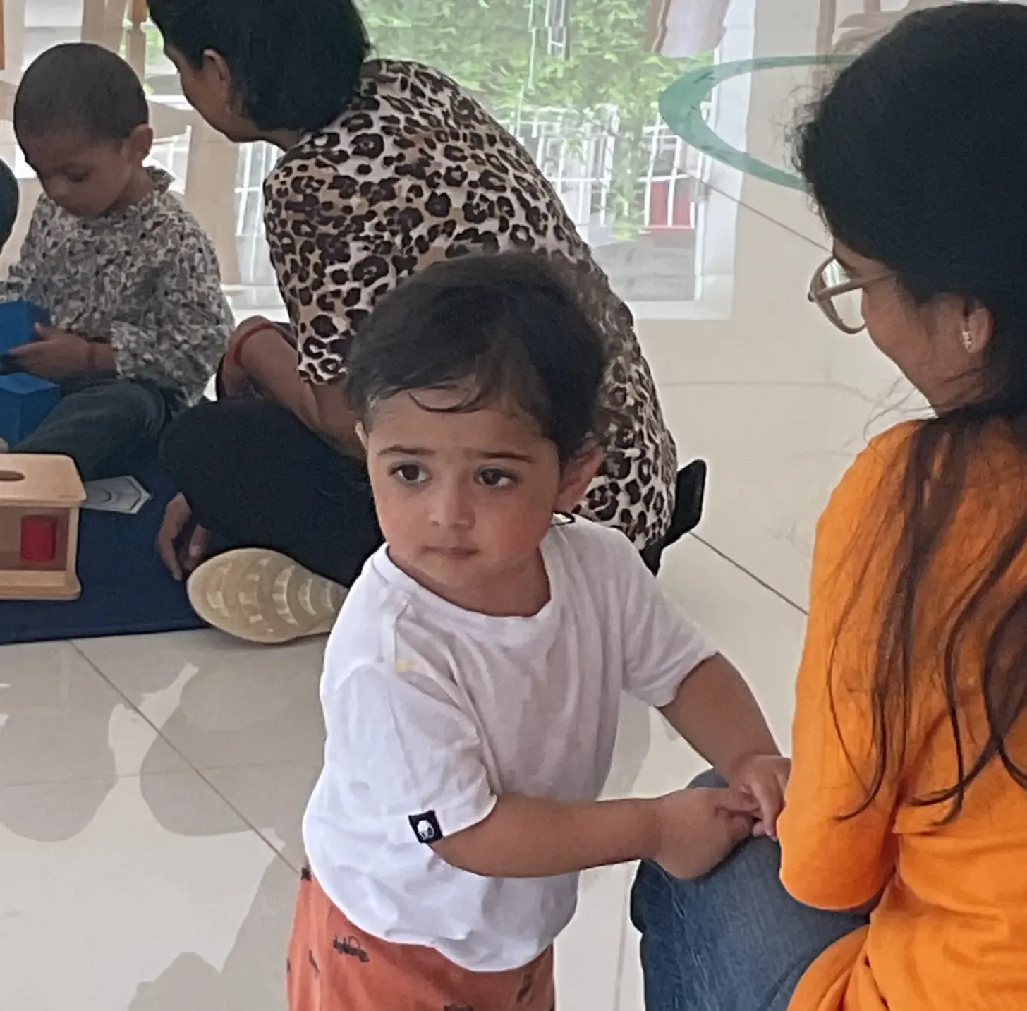 Toddler and educator interaction with open-house policy