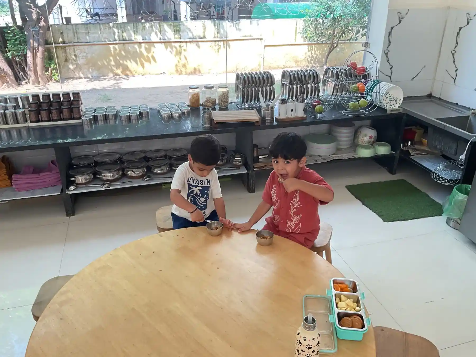Toddler-height dining counter with freshly prepared healthy snacks and meals