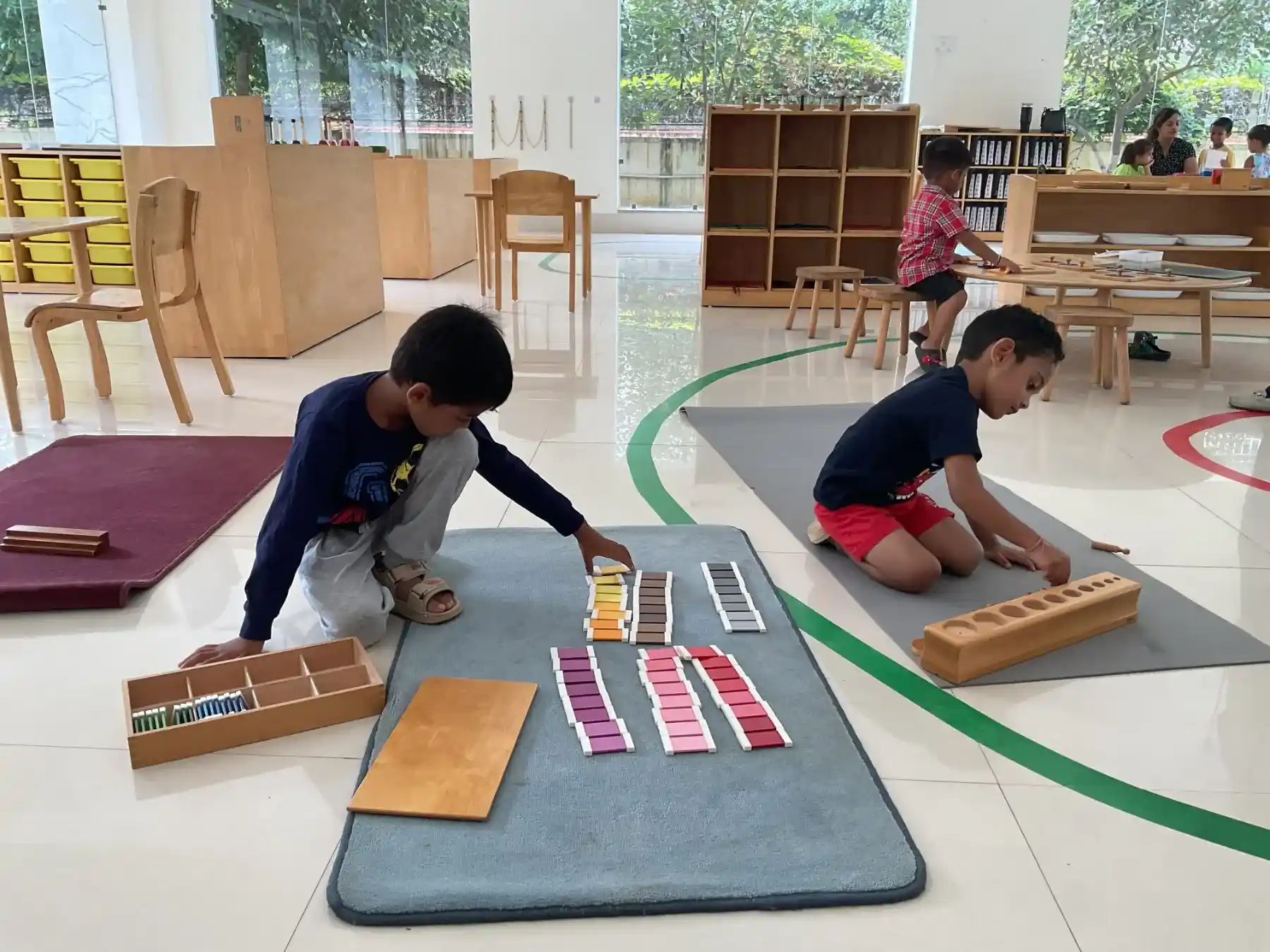 Child using Montessori Movable Alphabet with word cards